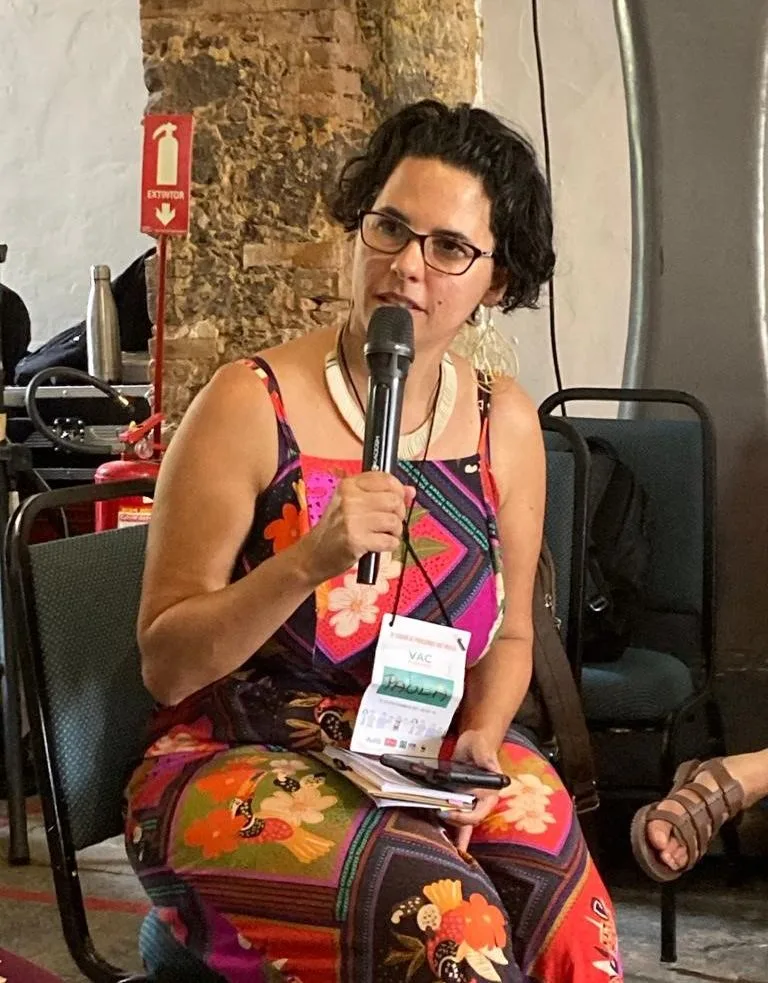 Paula Moreira speaking at a climate justice event in Brazil