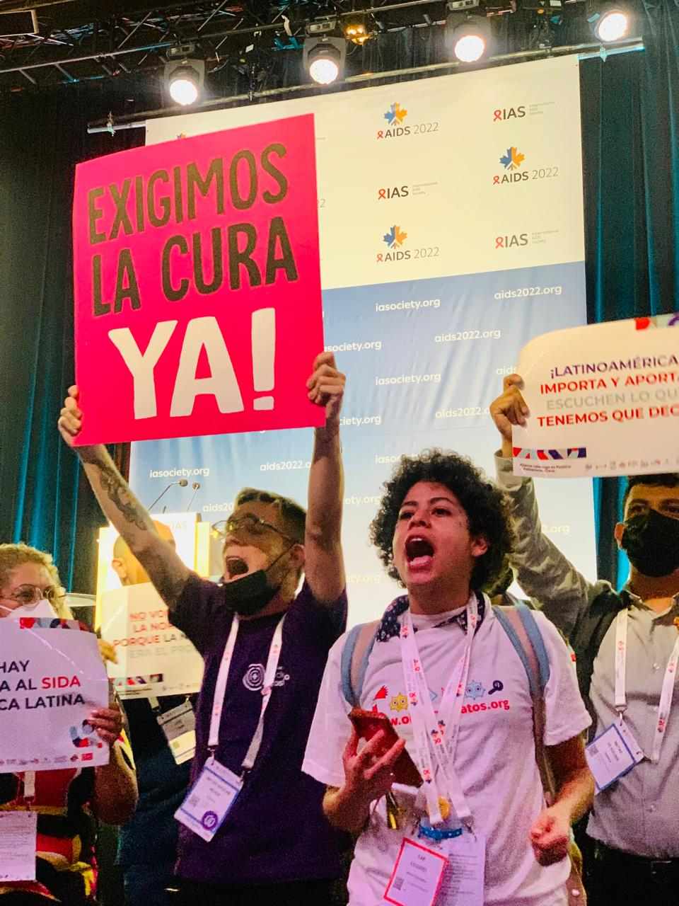 Irazú protesting at the AIDS 2022 conference