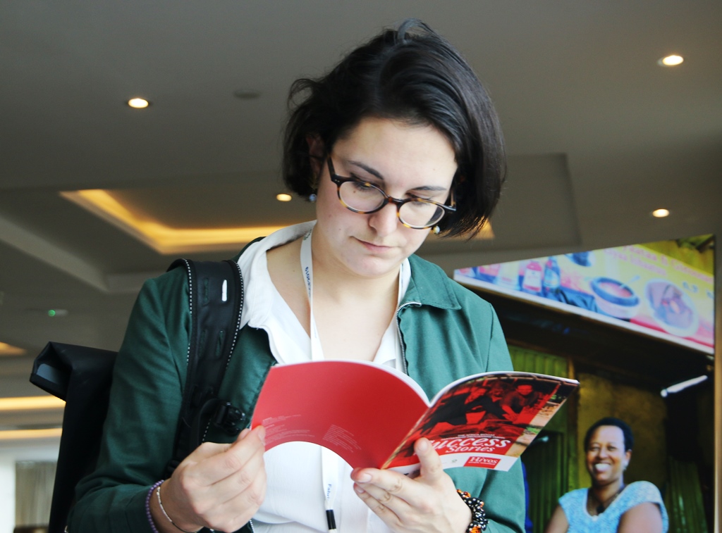 A participant reads an ABPP success stories booklet.